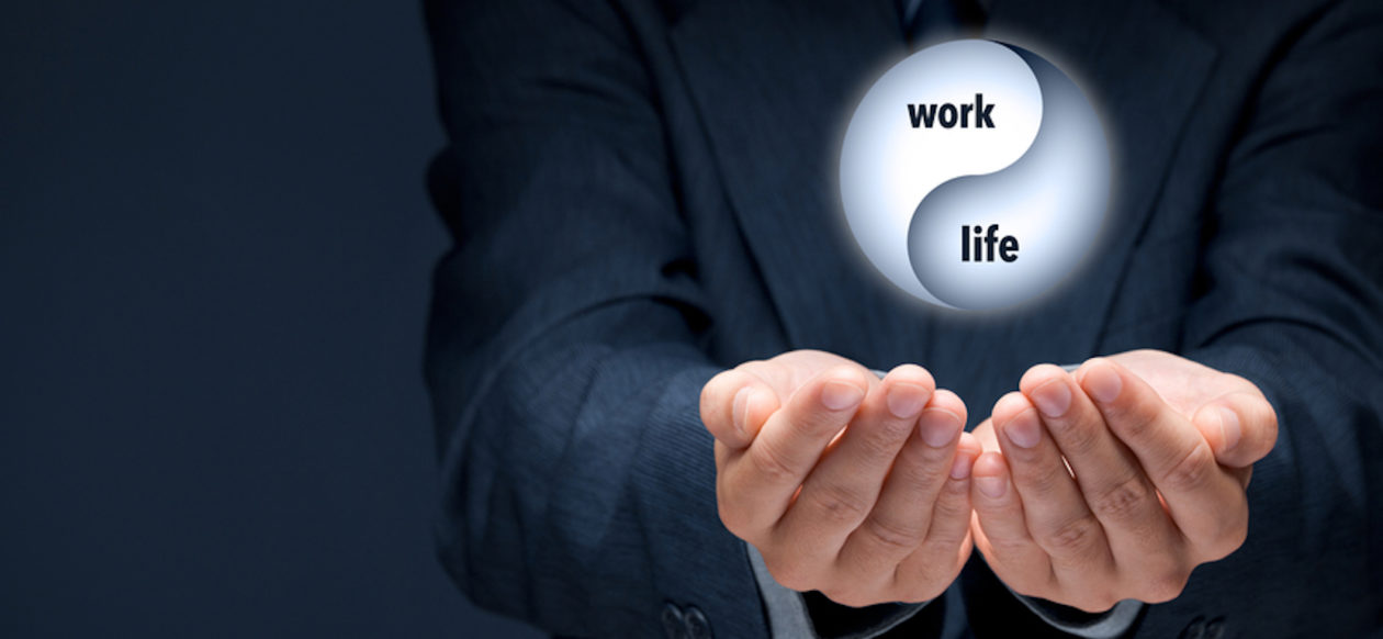 man's hands below the words work-life showing a balance between the two A New Outlook Recovery Services Colorado